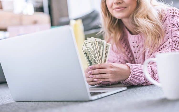 Cropped View Of Cheerful Woman Holding Dollar Banknotes